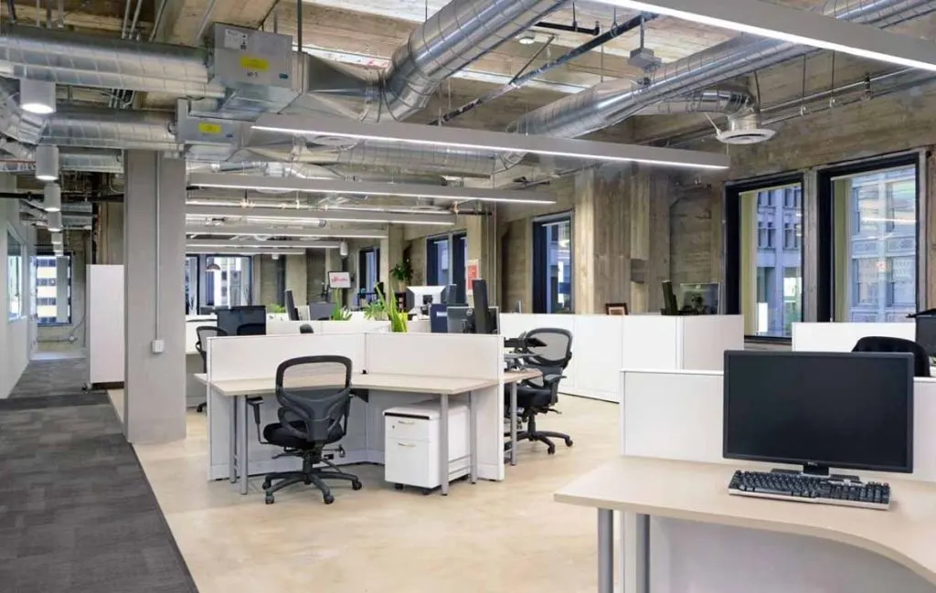 Open office with exposed spiral ductwork in Northern Virginia
